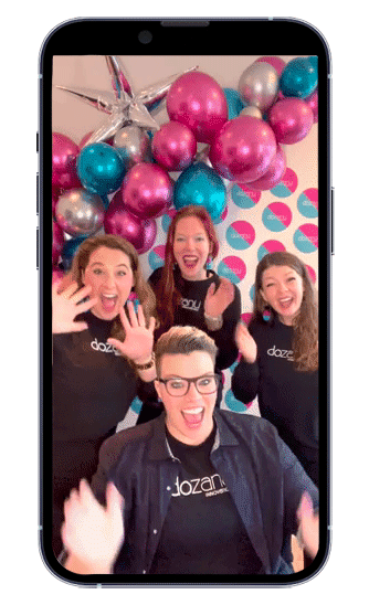 GIF of four dozanü team members on a smartphone smiling, waving, and signing “Hello!” in American Sign Language (ASL)