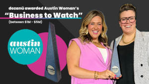 ID: A two-tone dark gray photo with a diagonal slash in the center. The title reads “dozanü awarded Austin Woman’s ‘Business to Watch’ (between $1M - $5M),” accompanied by the logos of Austin Woman and dozanü innovations. The image features an award and a photo of Michelle Lapides in a pink sleeveless blazer and Katherine Lees in a black and white blazer, both grinning and holding the award.